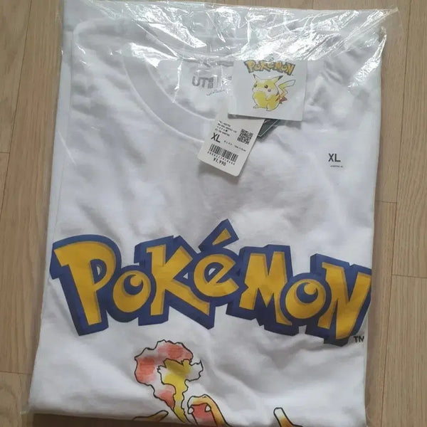 [BUNJANG] Uniqlo Pokemon Charizard Short Sleeve T-Shirt XL / 유니클로 uniqlo 포켓몬스터 pokemon 리자몽 반팔 티셔츠