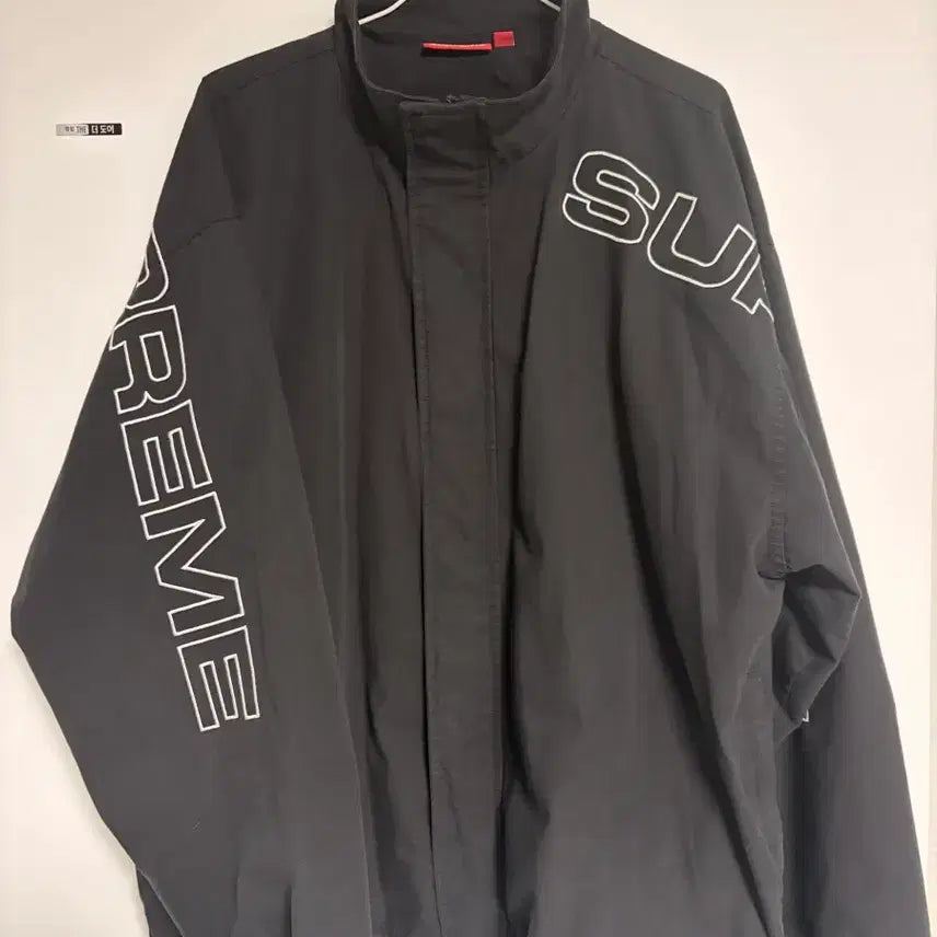 [BUNJANG] Supreme Spellout Embroidered Ripstop Track Jacket Black FW25 / (L)슈프림 스펠아웃 자수 립스탑 트랙 자켓 블랙 - 25FW