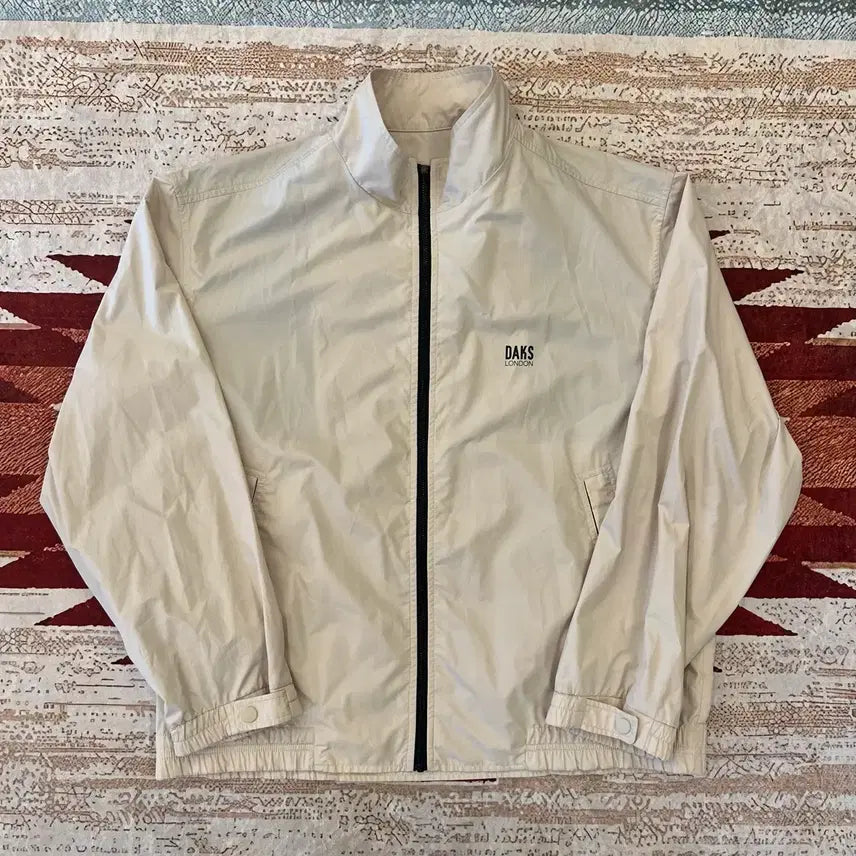 [BUNJANG] Daks London Logo Stand Neck Windbreaker Jacket (Ivory, L/100) / 닥스 런던 로고 스탠드넥 바람막이 자켓 [아이보리] L/100