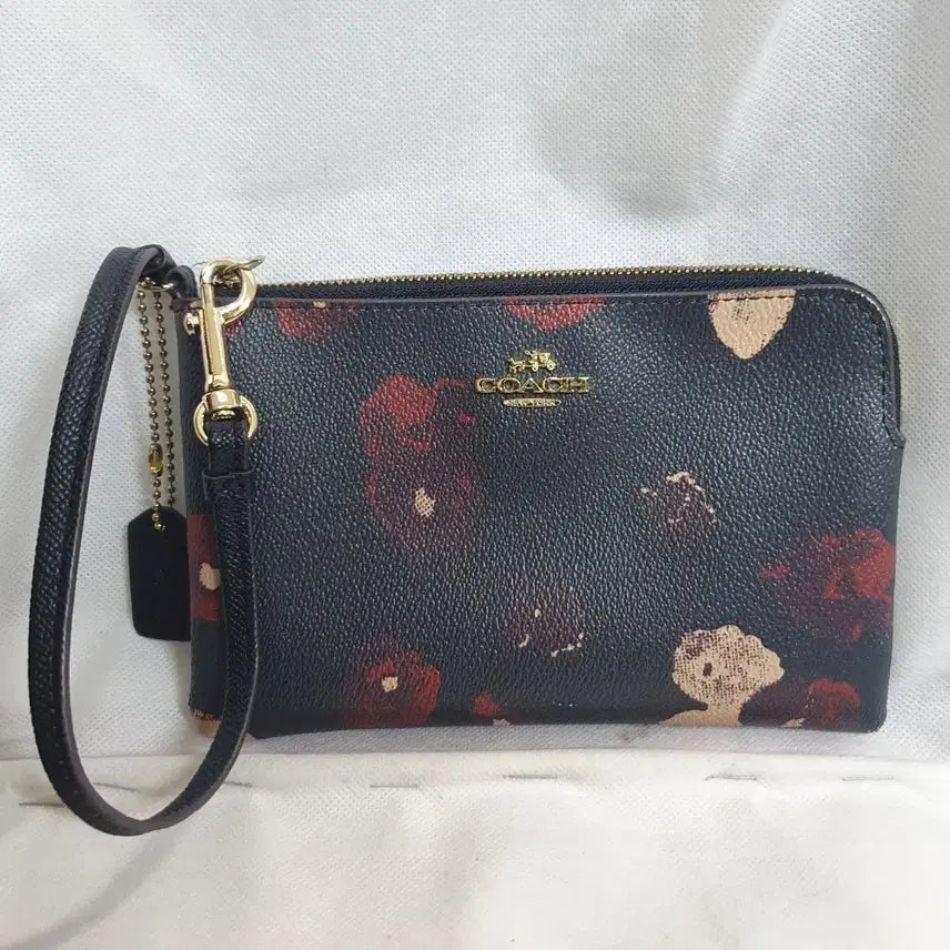 [BUNJANG] Coach Floral Pattern Wristlet Pouch / 코치 플로럴 패턴 손목스트랩 파우치
