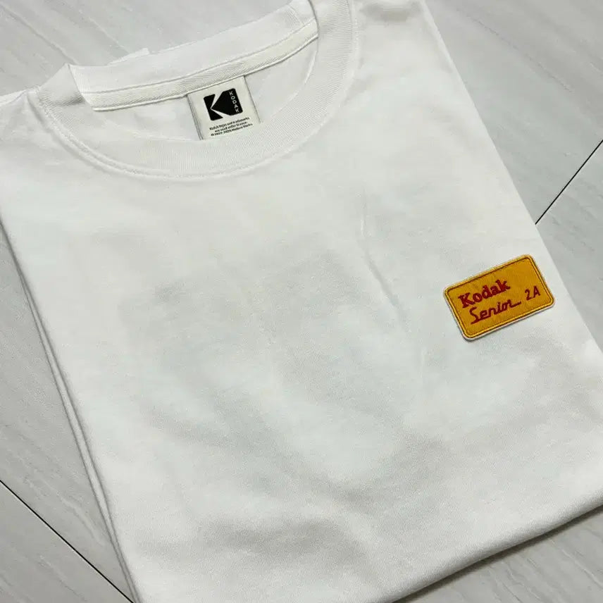 [BUNJANG] Kodak Apparel Treasure Island Graphic Semi-Oversized Short-Sleeve T-Shirt White S / 코닥 어패럴 트레져 아일랜드 백그래픽 세미오버핏 반팔 티셔츠 화이트 S