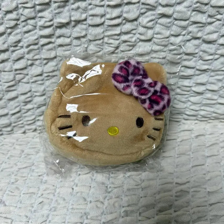 [BUNJANG] Sanrio Hello Kitty Tanning Mini Pouch / 산리오 미니페이스 파우치 헬로키티 태닝