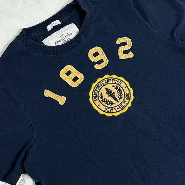[BUNJANG] Abercrombie & Fitch Embroidered Olympic Torch Patch Lettering Short Sleeve T-Shirt Navy / 아베크롬비  자수 올림픽 성화 패치 레터링 반팔 네이비