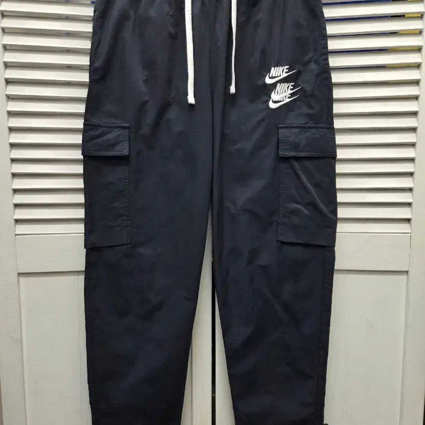 [BUNJANG] Nike NSW World Tour Woven Jogger Pants / 나이키 NSW 월드투어 우븐 조거 팬츠