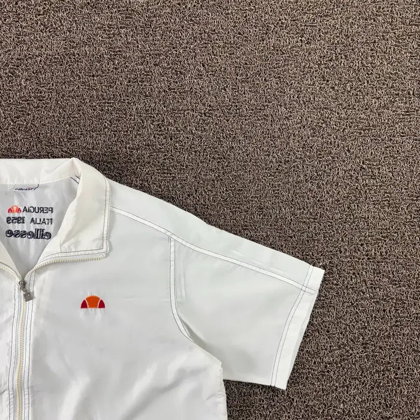 [BUNJANG] Ellesse Small Logo Short Sleeve Windbreaker / 엘레쎄 스몰로고 반팔 바람막이