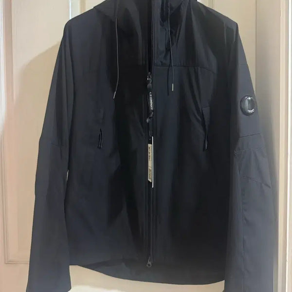 [BUNJANG] CP Company 26SS Proteck Lens Hood Jacket Black / 씨피컴퍼니 26ss 프로텍 렌즈 후드 바람막이 자켓 블랙
