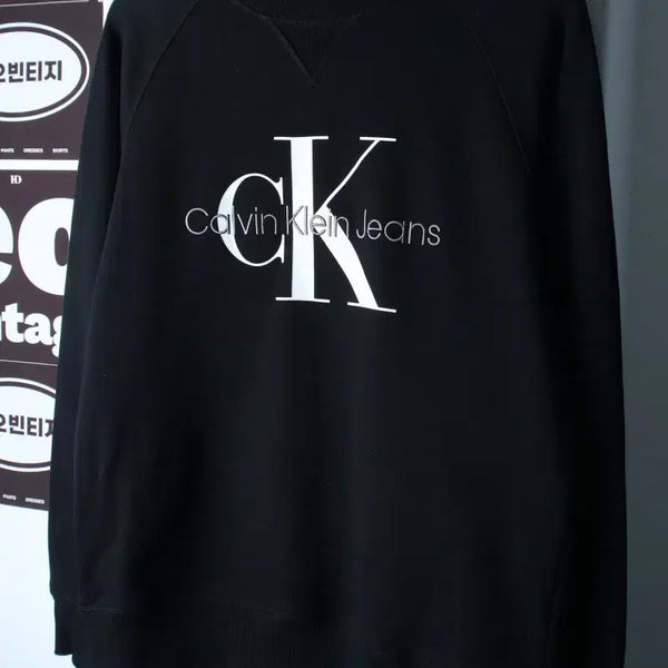 [BUNJANG] Calvin Klein Big Logo Raglan Sweatshirt Black / (S-M) 캘빈클라인 맨투맨 티셔츠 빅로고 나그랑 블랙 놈코어-H38025