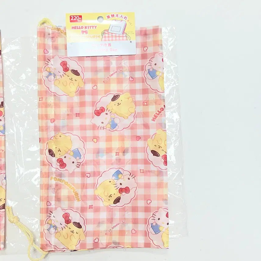 [BUNJANG] Sanrio Hello Kitty x Pompompurin Drawstring Pouch / 헬로키티x폼폼푸린 옷 조이개 파우치