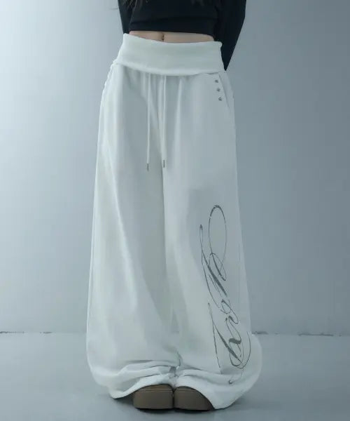 [LOOXP] Graphic Rivet Folding Training Wide Long Pants - Ivory / 그래픽 리벳 폴딩 트레이닝 와이드 롱팬츠 아이보리