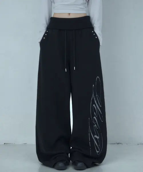 [LOOXP] Graphic Rivet Folding Training Wide Long Pants Black / 그래픽 리벳 폴딩 트레이닝 와이드 롱팬츠 블랙